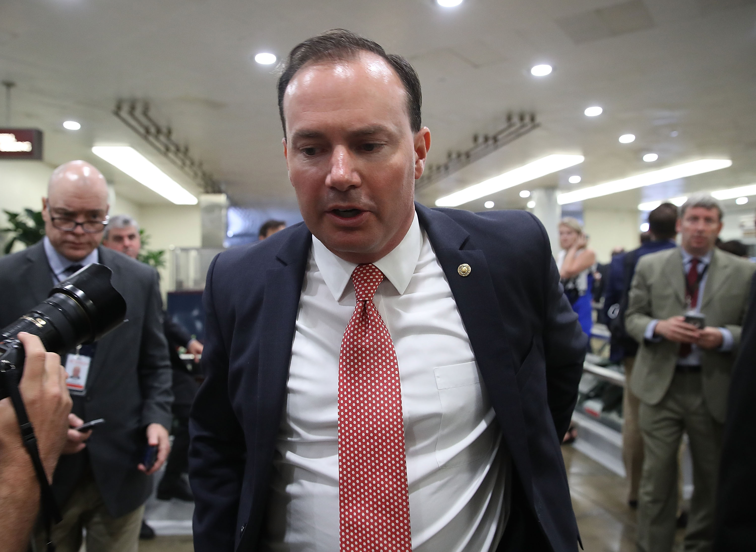 WASHINGTON, DC - JULY 18: Sen. Mike Lee (R-UT) walks past reporters inside the US Capitol on July 18, 2017 in Washington, DC. Sen. Lee said he would vote no Senate Majority Leader Mitch McConnell's bid to overhaul the Affordable Care Act. (Photo by Mark Wilson/Getty Images)