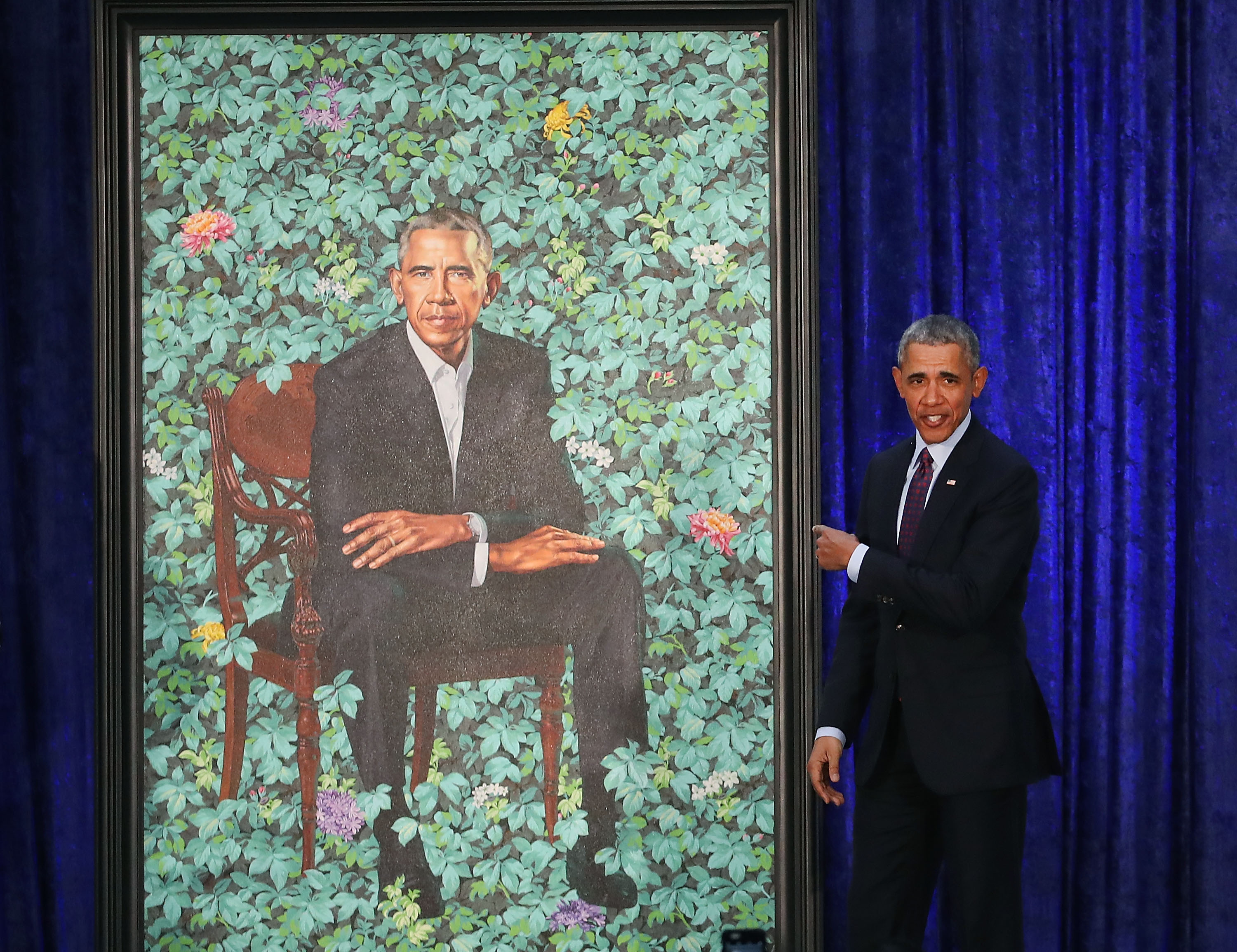 WASHINGTON, DC - FEBRUARY 12: Former U.S. President Barack Obama stands next to his newly unveiled portrait during a ceremony at the Smithsonian's National Portrait Gallery, on February 12, 2018 in Washington, DC. The portraits were commissioned by the Gallery, for Kehinde Wiley to create President Obama's portrait, and Amy Sherald that of Michelle Obama. (Photo by Mark Wilson/Getty Images)