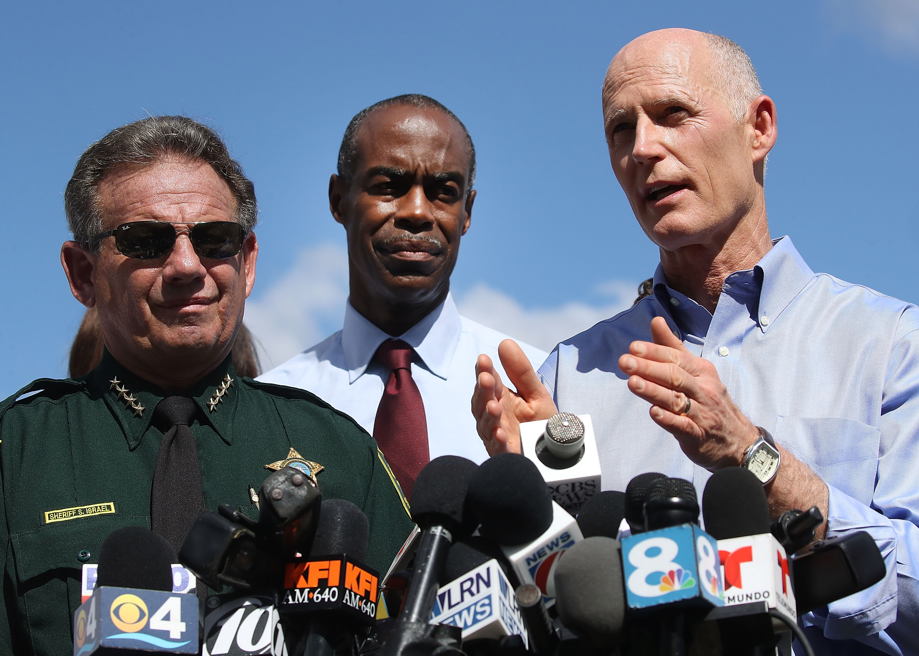 PARKLAND, FL - FEBRUARY 15: Florida Governor Rick Scott (R), Broward County Superintendent of Schools, Robert W. Runcie (C) and Broward County Sheriff, Scott Israel (L) speak to the media about the mass shooting at Marjory Stoneman Douglas High School where 17 people were killed yesterday, on February 15, 2018 in Parkland, Florida. Police arrested the suspect after a short manhunt, and have identified him as 19 year old former student Nikolas Cruz. (Photo by Mark Wilson/Getty Images)