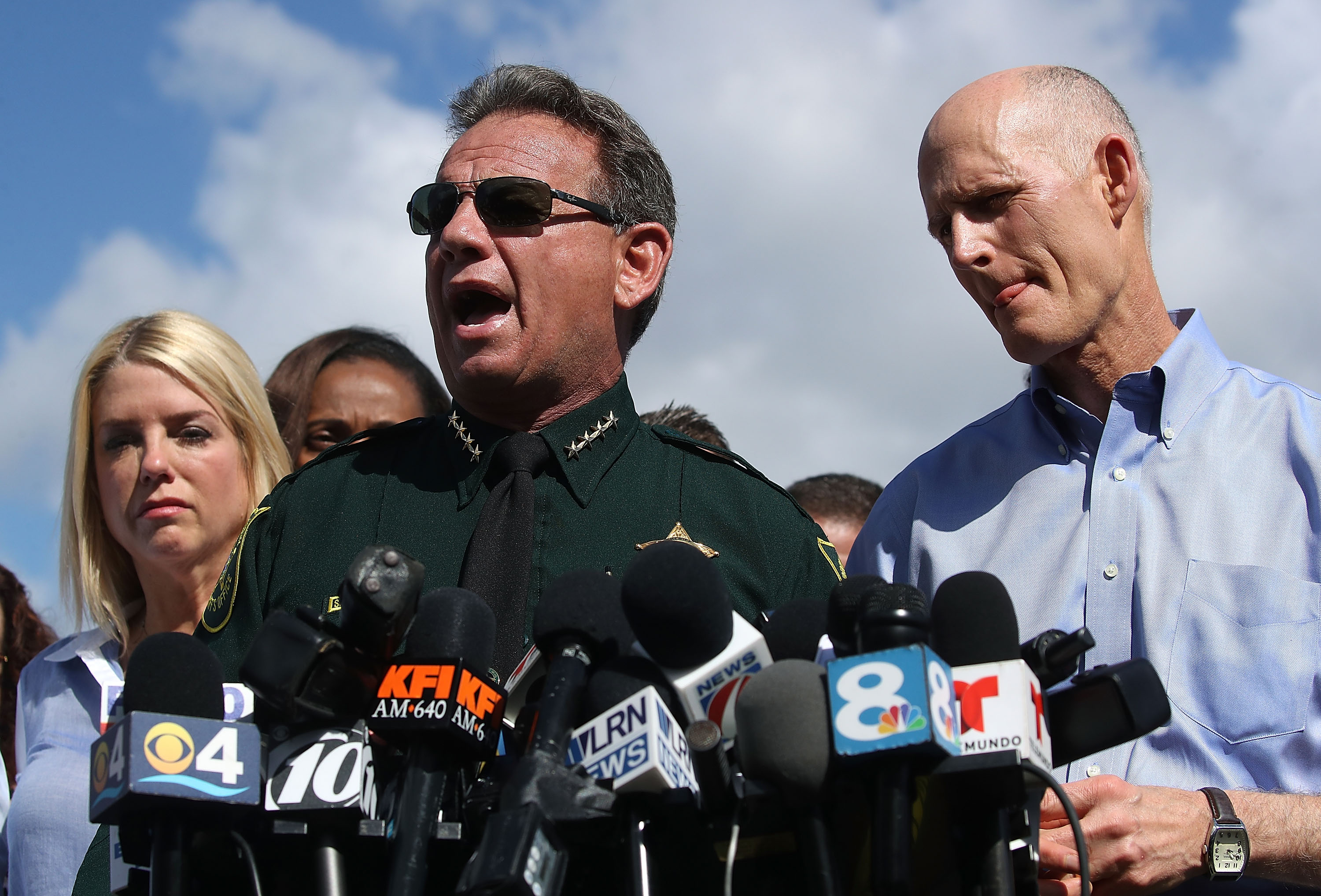 PARKLAND, FL - FEBRUARY 15: Broward County Sheriff, Scott Israel (C), Florida Governor Rick Scott,(R),and Florida Attorney General Pam Bondi,(L), speak to the media about the mass shooting at Marjory Stoneman Douglas High School where 17 people were killed yesterday, on February 15, 2018 in Parkland, Florida. Police arrested the suspect after a short manhunt, and have identified him as 19 year old former student Nikolas Cruz. (Photo by Mark Wilson/Getty Images)