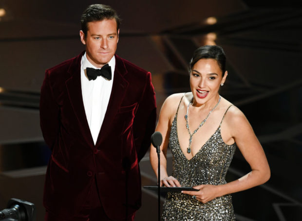 HOLLYWOOD, CA - MARCH 04: Actors Armie Hammer (L) and Gal Gadot speak onstage during the 90th Annual Academy Awards at the Dolby Theatre at Hollywood & Highland Center on March 4, 2018 in Hollywood, California. (Photo by Kevin Winter/Getty Images)
