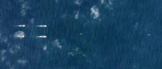 Satellite photo dated March 26, 2018 shows Chinese ships south of Hainan, China. Planet Labs/Handout via REUTERS