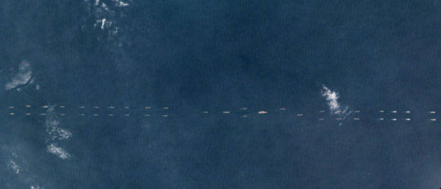 Satellite photo dated March 26, 2018 shows Chinese ships south of Hainan, China. Planet Labs/Handout via REUTERS