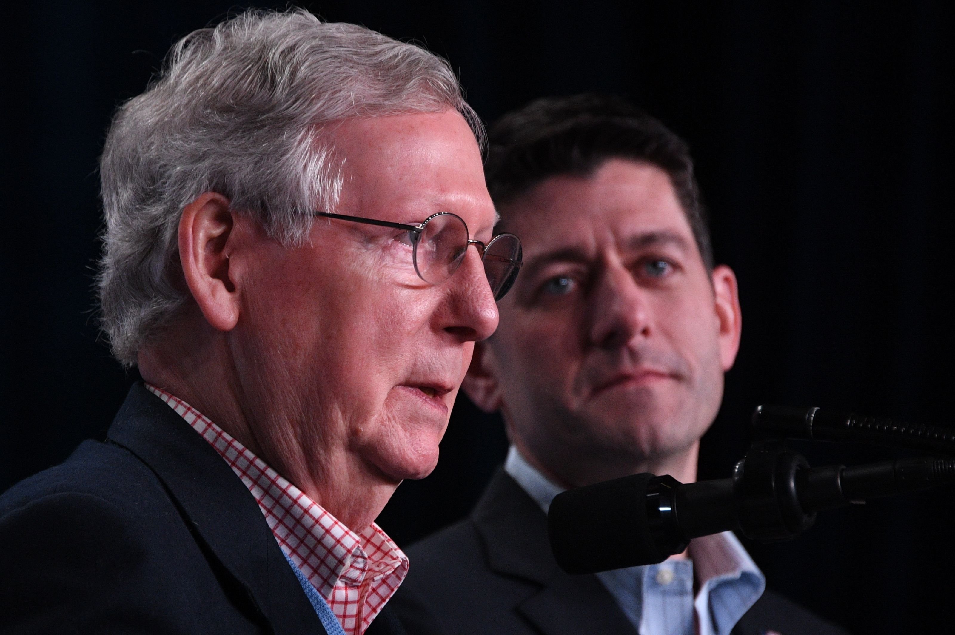 House Speaker Paul Ryan (R) and Senate majority leader Mitch McConnell (L) deliver a speech in White Sulphur Springs, West Virginia during the Republican party retreat on February 01, 2018 (JIM WATSON/AFP/Getty Images)