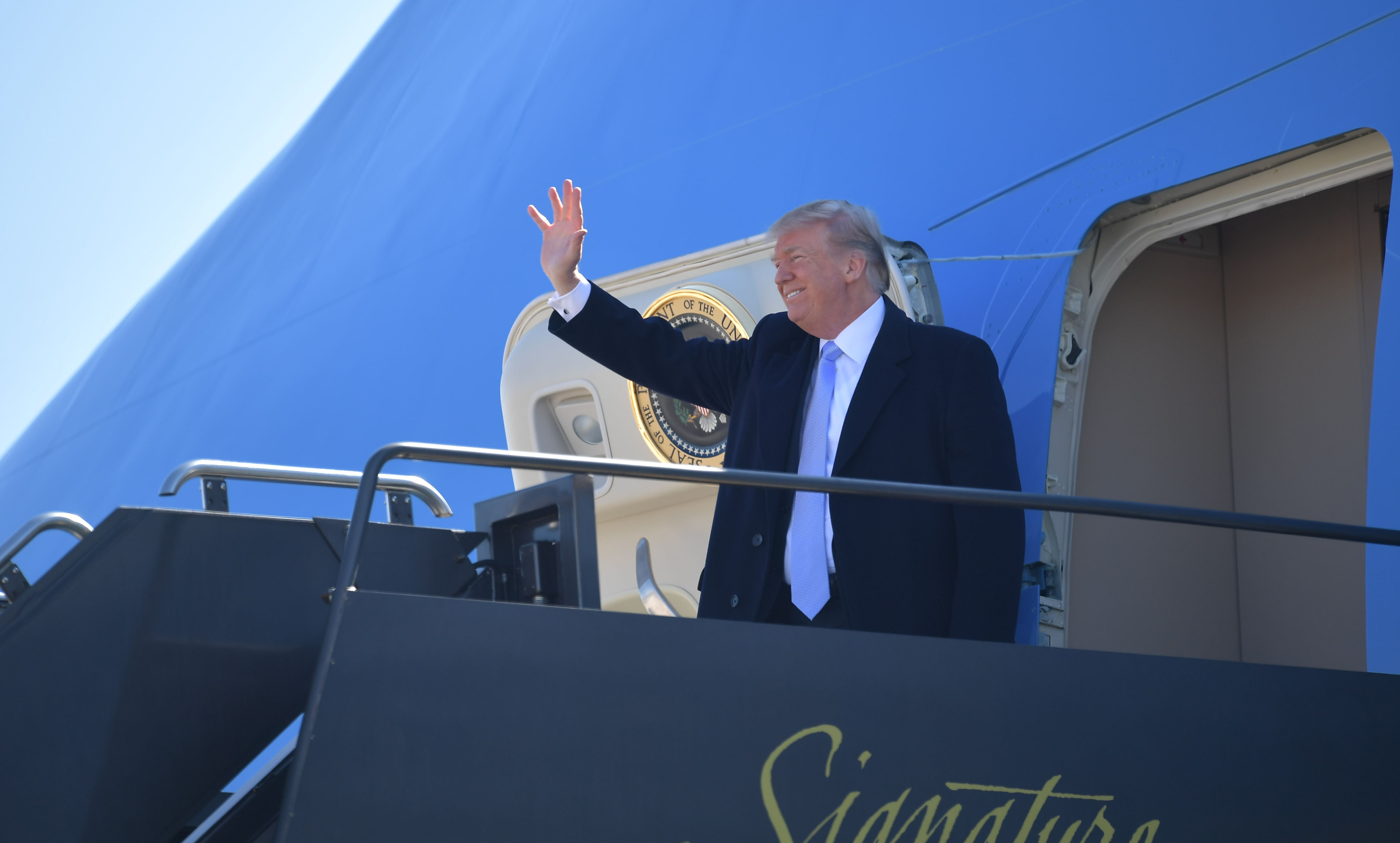 US President Donald Trump steps off Air Force One upon arrival at St. Louis Lambert International Airport in St. Louis, Missouri on March 14, 2018 (MANDEL NGAN/AFP/Getty Images)