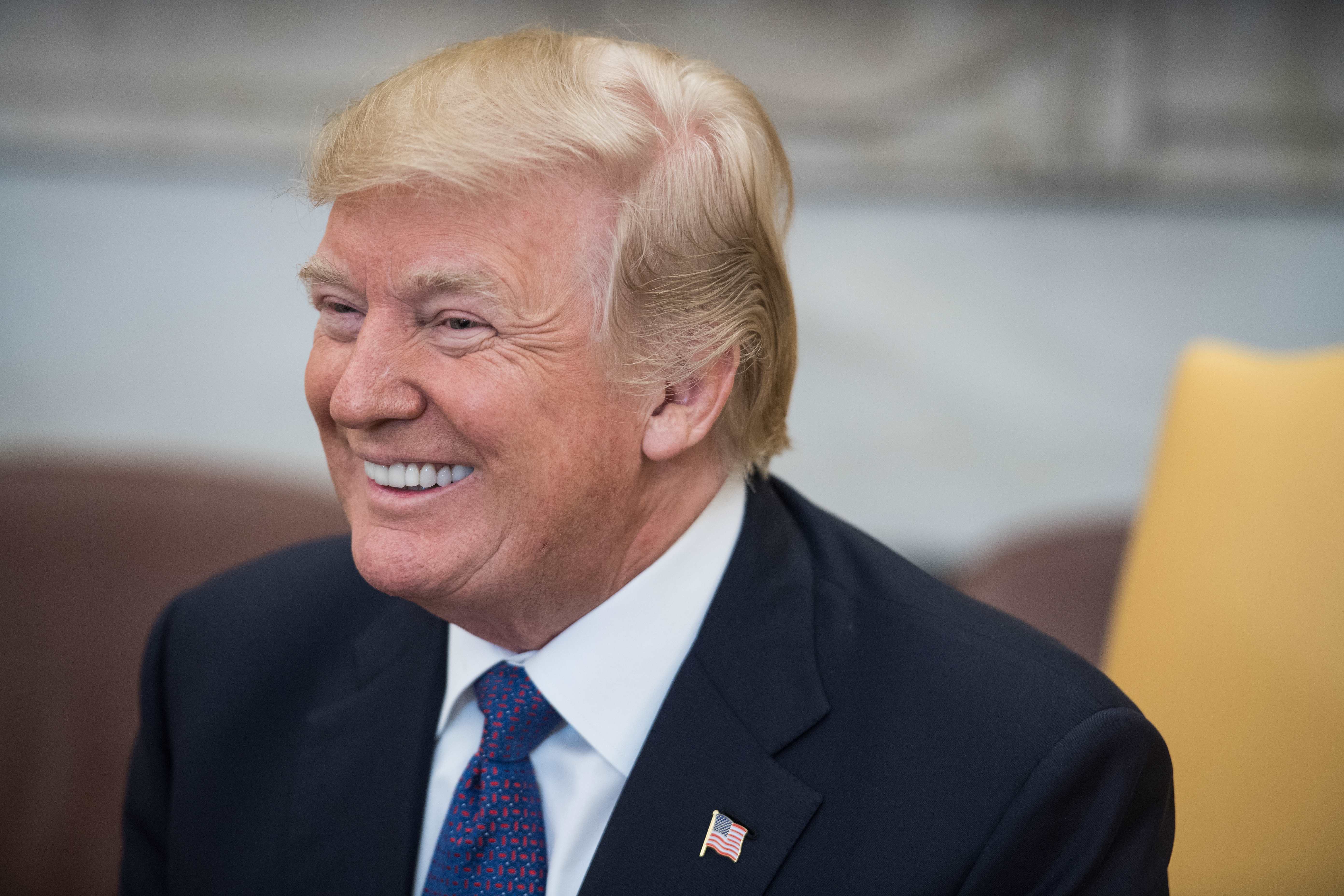US President Donald Trump smiles during his meeting with his Kazakh counterpart Nursultan Nazarbayev in the Oval office at the White House in Washington, DC, on January 16, 2018 (NICHOLAS KAMM/AFP/Getty Images)