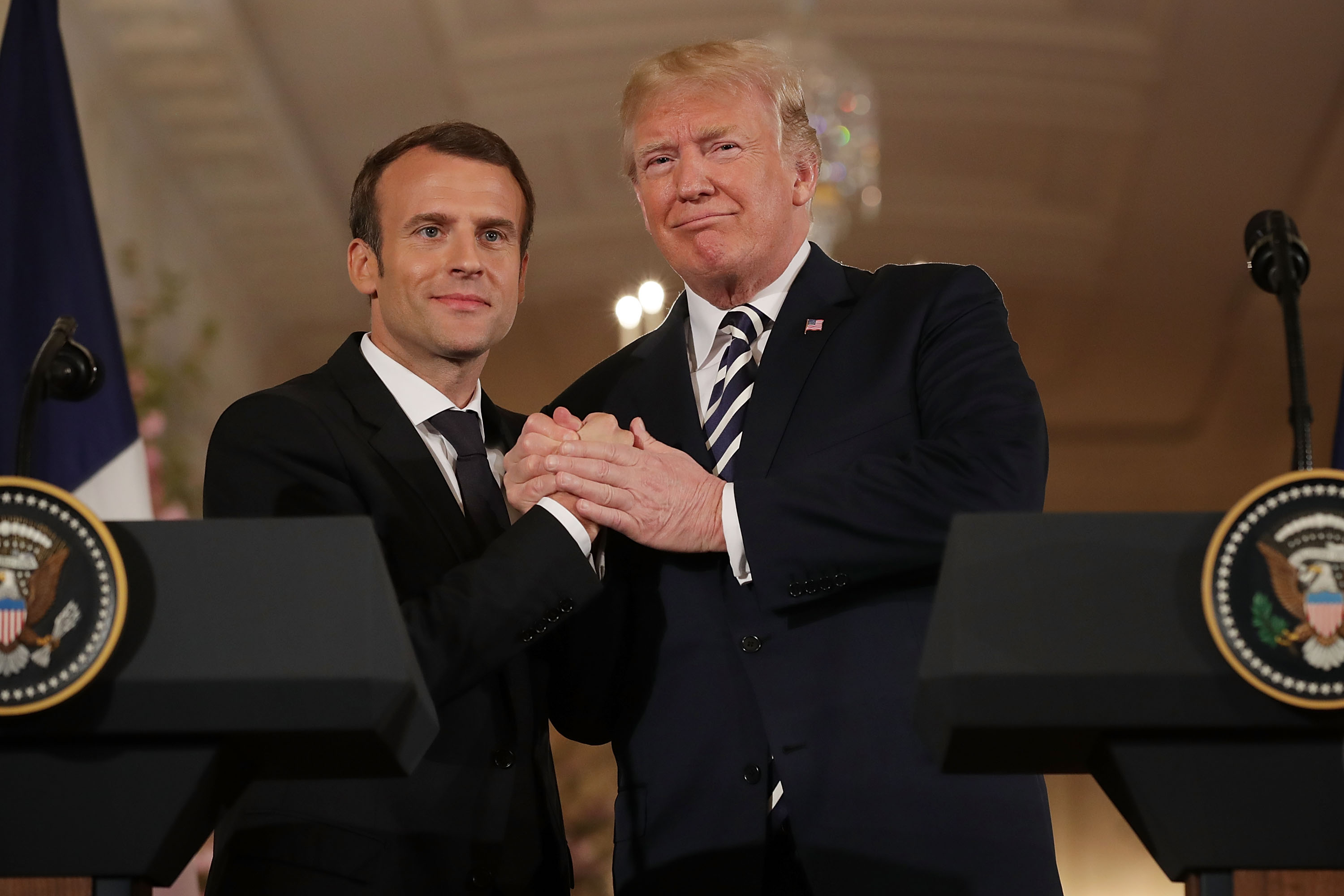 WASHINGTON, DC - APRIL 24: French President Emmanuel Macron (L) and U.S. President Donald Trump shake hands at the completion of a joint press conference in the East Room of the White House April 24, 2018 in Washington, DC. Macron and Trump met throughout the day to discuss a range of bilateral issues as Trump holds his first official state visit with the French president. (Photo by Chip Somodevilla/Getty Images)