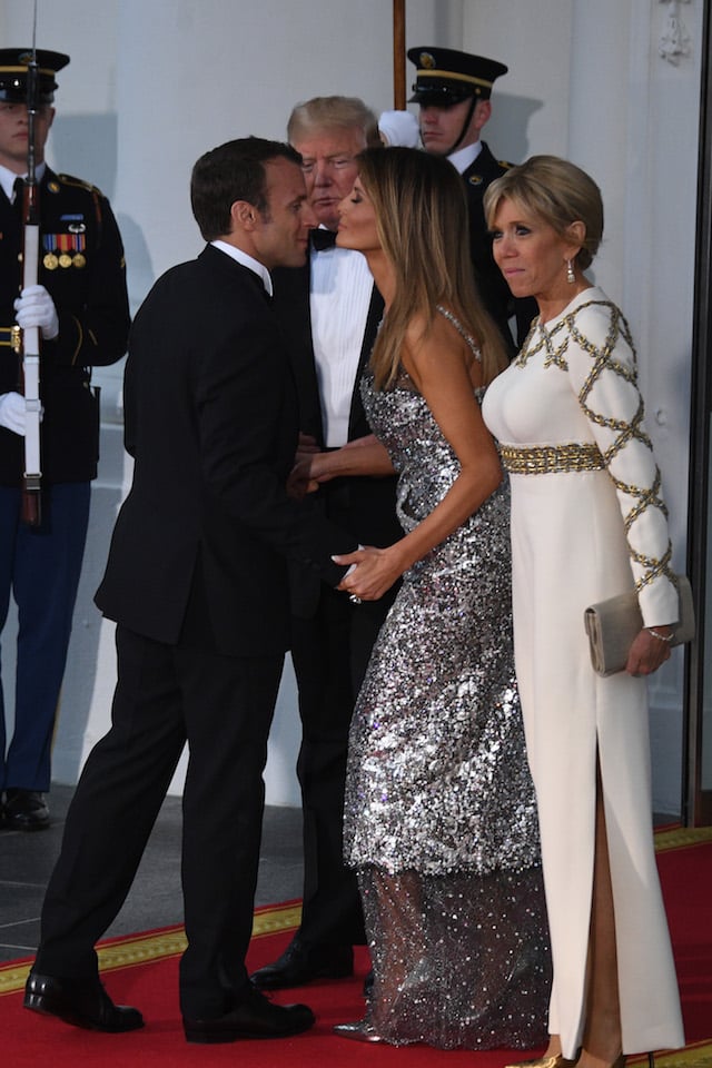 US President Donald Trump and First Lady Melania Trump welcome French President Emmanuel Macron and his wife, Brigitte Macron, as they arrive for a State Dinner at the North Portico of the White House in Washington, DC, April 24, 2018. (Photo by JIM WATSON / AFP) (Photo credit should read JIM WATSON/AFP/Getty Images)