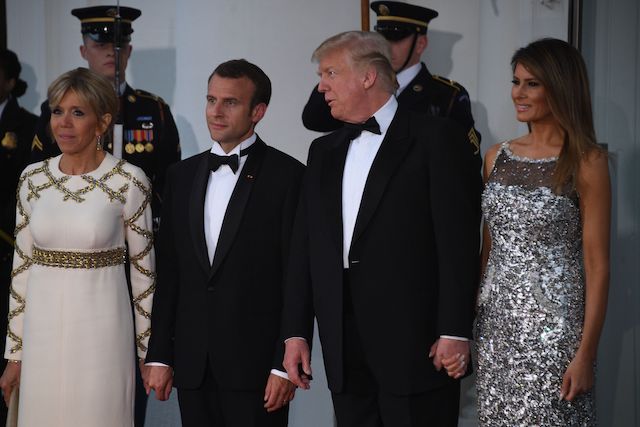 US President Donald Trump and First Lady Melania Trump welcome French President Emmanuel Macron and his wife, Brigitte Macron, as they arrive for a State Dinner at the North Portico of the White House in Washington, DC, April 24, 2018. (Photo by JIM WATSON / AFP) (Photo credit should read JIM WATSON/AFP/Getty Images)