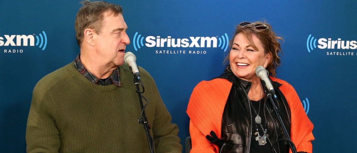 NEW YORK, NY - MARCH 27: (L-R) Actors John Goodman and Roseanne Barr speak during SiriusXM's Town Hall with the cast of Roseanne on March 27, 2018 in New York City. (Photo by Astrid Stawiarz/Getty Images for SiriusXM)