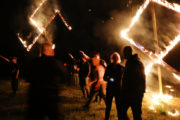 DRAKETOWN, GA - APRIL 21: Members of the National Socialist Movement, one of the largest neo-Nazi groups in the US, hold a swastika burning after a rally on April 21, 2018 in Draketown, Georgia. Community members had opposed the rally in Newnan and came out to embrace racial unity in the small Georgia town. Fearing a repeat of the violence that broke out after Charlottesville, hundreds of police officers were stationed in the town during the rally in an attempt to keep the anti racist protesters and neo-Nazi groups separated. (Photo by Spencer Platt/Getty Images)