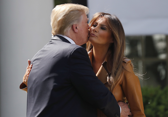 U.S. President Donald Trump kisses first lady Melania Trump at the launch of her "Be Best" initiative in the Rose Garden at the White House in Washington, U.S., May 7, 2018. REUTERS/Leah Millis - HP1EE571I0ZPN