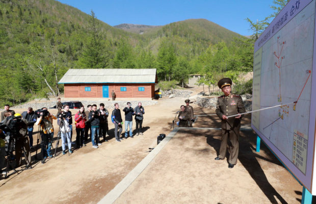 A North Korean official explains the procedure and process of dismantling Punggye-ri nuclear test ground before they blow up the facilities in Punggye-ri, North Hamgyong Province, North Korea May 24, 2018. Picture taken May 24, 2018. News1/Pool via REUTERS