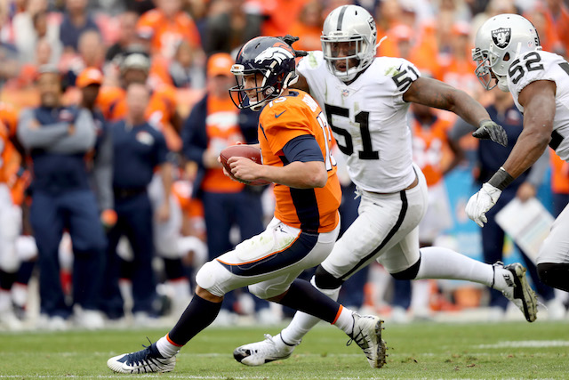 Trevor Siemian #13 of the Denver Broncos is chased out of the pocket by Bruce Irvin #51 of the Oakland Raiders at Sports Authority Field at Mile High on October 1, 2017 in Denver, Colorado. (Photo by Matthew Stockman/Getty Images)