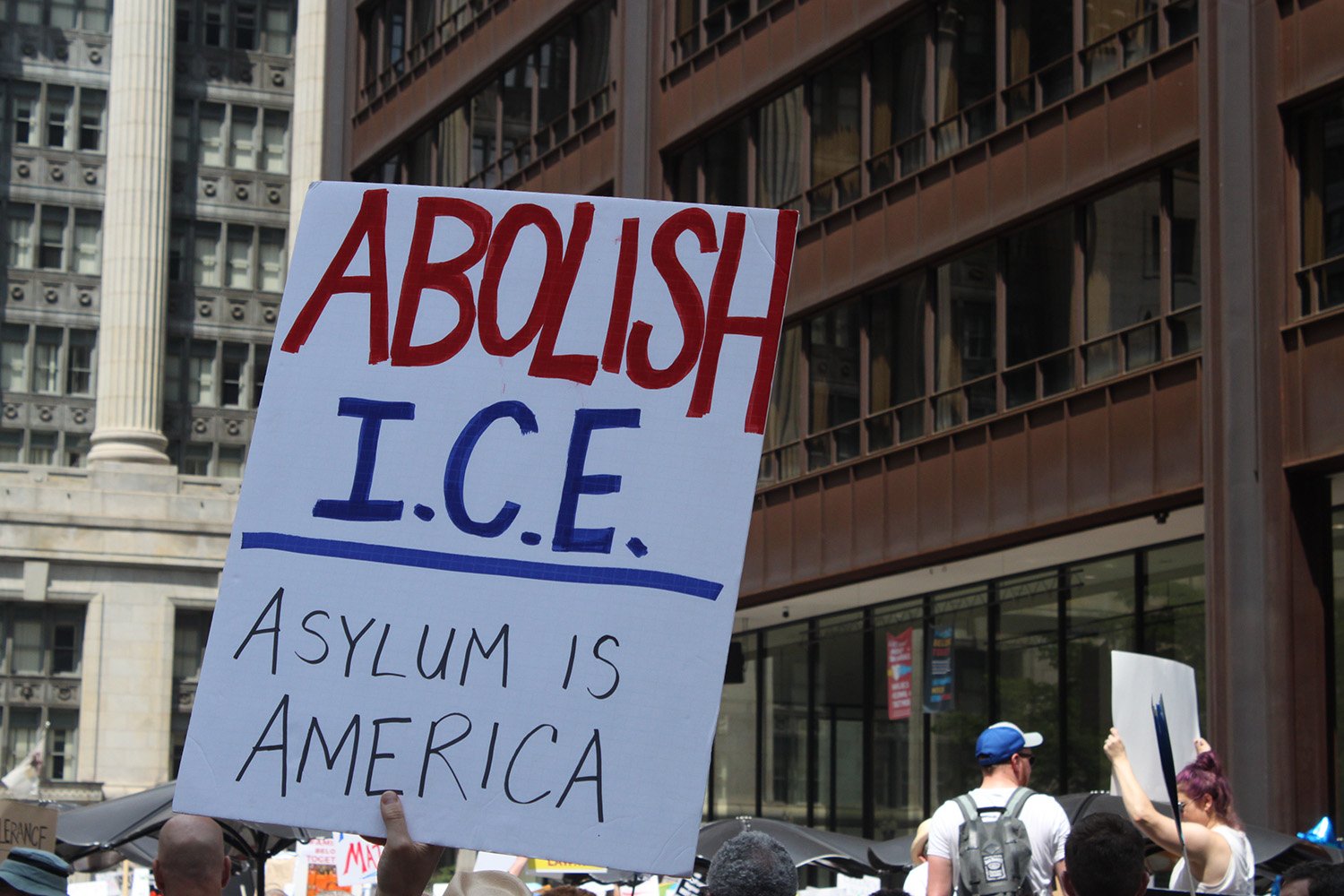 A protester holds up a sign calling for the abolition of Immigration and Customs Enforcement at a demonstration in Chicago on June 30, 2018. Will Racke/TheDCNF