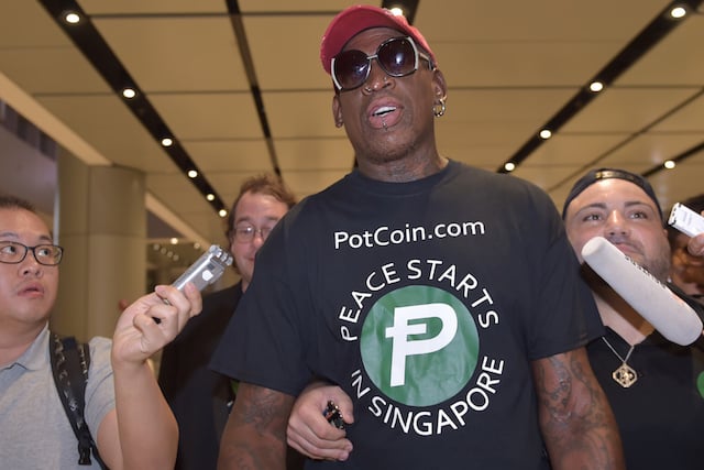 Retired American professional basketball player Dennis Rodman speaks to the press as he arrives at Changi International airport ahead of US-North Korea summit in Singapore on June 11, 2018. - North Korea's Kim Jong Un and US President Donald Trump meet on June 12 for an unprecedented summit in an attempt to address the last festering legacy of the Cold War, with the US President calling it a "one time shot" at peace. (Photo by ADEK BERRY / AFP) (Photo credit should read ADEK BERRY/AFP/Getty Images)