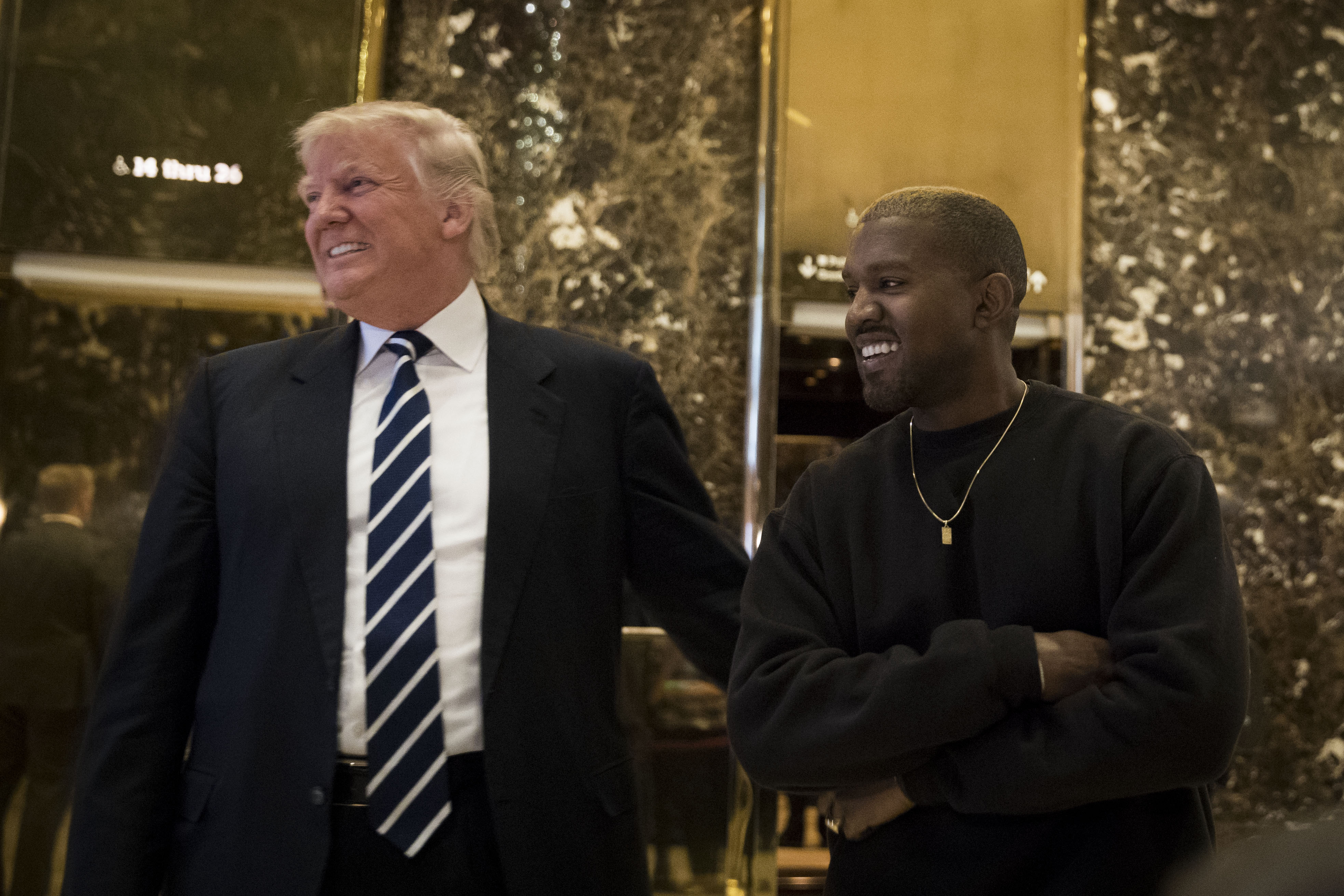 President-elect Donald Trump and Kanye West stand together in the lobby at Trump Tower (Drew Angerer/Getty Images)