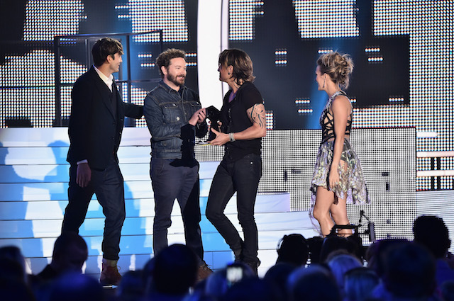NASHVILLE, TN - JUNE 07: Carrie Underwood and Keith Urban receive award onstage from Ashton Kutcher and Danny Masterson during the 2017 CMT Music Awards at the Music City Center on June 6, 2017 in Nashville, Tennessee. (Photo by Michael Loccisano/Getty Images for CMT)