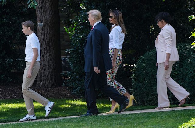 US President Donald Trump (2nd L), First Lady Melania Trump (2nd R), their son Barron and Melania Trump's mother Amalija Knavs walk to board Marine One at the White House in Washington, DC, on June 29, 2018 as they depart for Bedminster, New Jersey. (Photo credit: NICHOLAS KAMM/AFP/Getty Images)