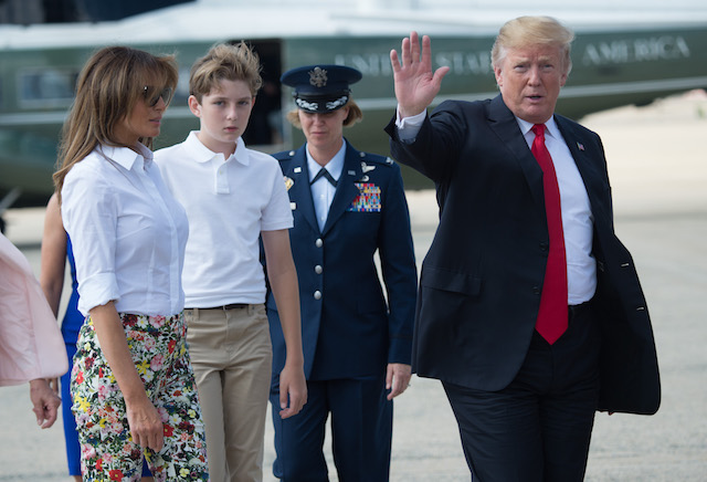 US President Donald Trump, First Lady Melania Trump and son Barron walk to Air Force One prior to departure from Joint Base Andrews in Maryland, June 29, 2018, as they travel to Bedminster, New Jersey for the weekend. (Photo credit: SAUL LOEB/AFP/Getty Images)