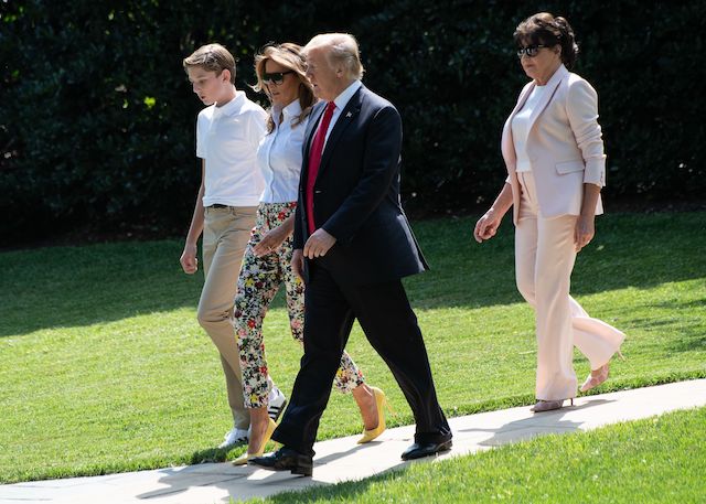 US President Donald Trump (2nd L), First Lady Melania Trump (2nd R), their son Barron and Melania Trump's mother Amalija Knavs walk to board Marine One at the White House in Washington, DC, on June 29, 2018 as they depart for Bedminster, New Jersey. (Photo credit: NICHOLAS KAMM/AFP/Getty Images)