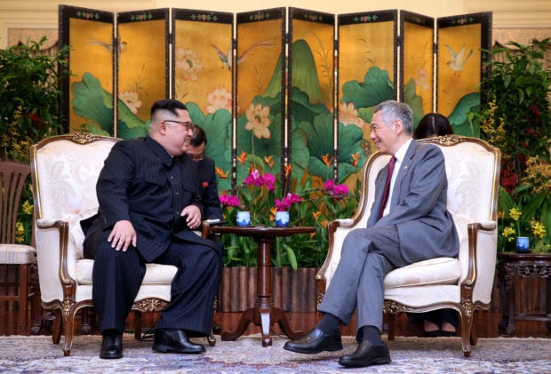 North Korea's leader Kim Jong Un shakes hands with Singapore's Prime Minister Lee Hsien Loong at the Istana in Singapore, June 10, 2018 in this picture obtained from social media. SINGAPORE'S MINISTRY OF COMMUNICATIONS AND INFORMATION/via REUTERS