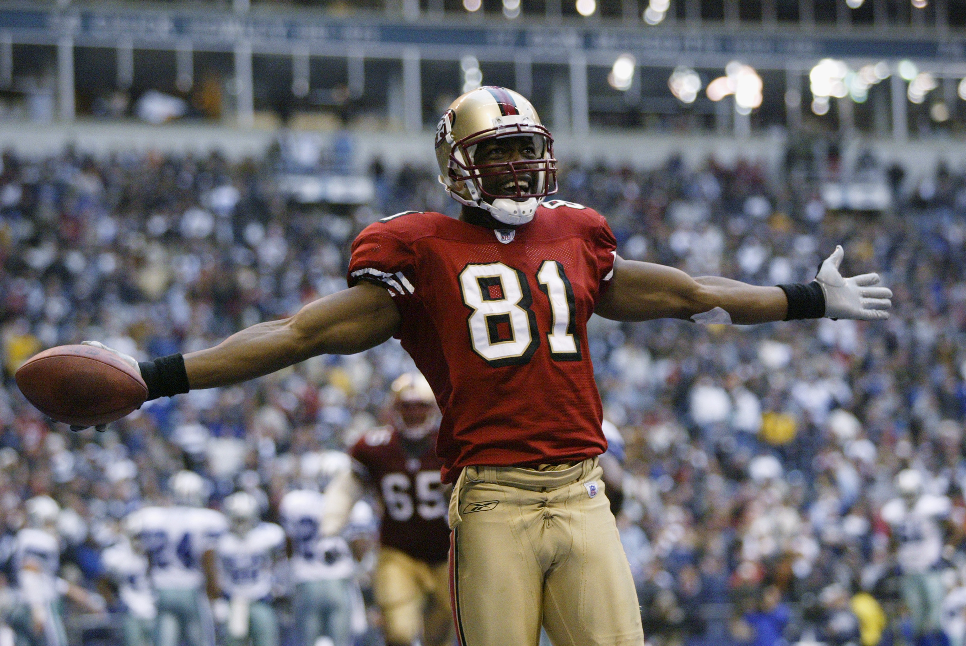 IRVING, TX - DECEMBER 8: Wide receiver Terrell Owens #81 of the San Francisco 49ers celebrates in the end zone after scoring a touchdown against the Dallas Cowboys with 12 seconds left on December 8, 2002 at Texas Stadium in Irving, Texas. The 49ers beat the Cowboys 31-27. (Photo by Brian Bahr/Getty Images)
