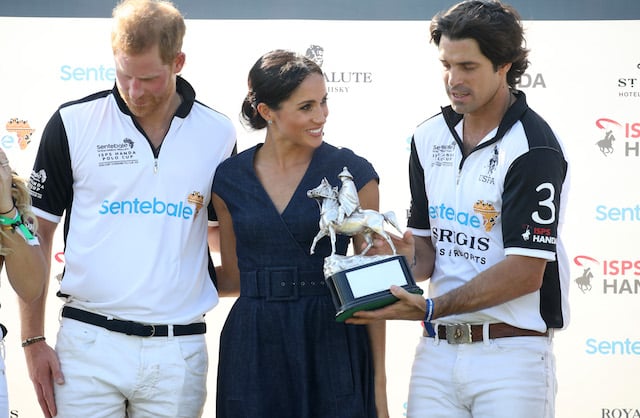 Nacho Figuares of Sentebale St. Regis presents the Sentebale Polo 2018 trophy with Meghan Duchess of Sussex and Prince Harry Duke of Sussex after the Sentebale Polo 2018 held at the Royal County of Berkshire Polo Club on July 26, 2018 in Windsor, England. (Photo by Chris Jackson/Getty Images)