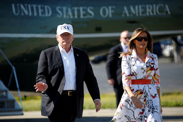 U.S. President Donald Trump and U.S. first lady Melania Trump walk from Marine One as they depart from Morristown, New Jersey, U.S., July 8, 2018. REUTERS/Joshua Roberts