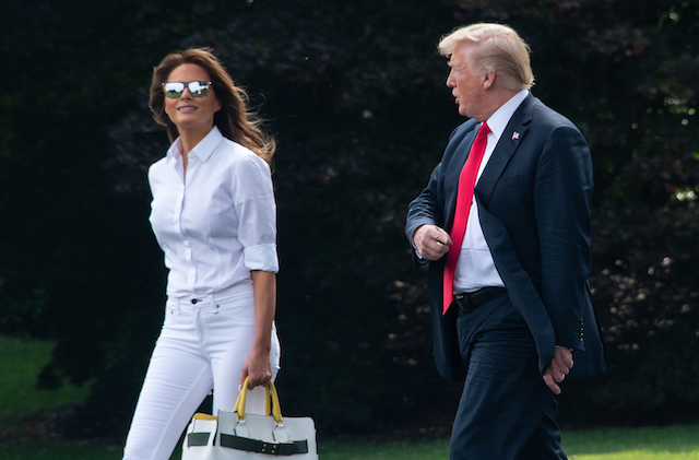US President Donald Trump and First Lady Melania Trump walk to board Marine One at the White House in Washington, DC, on July 27, 2018 as they head to spend the weekend in New Jersey. (Photo credi: NICHOLAS KAMM/AFP/Getty Images)