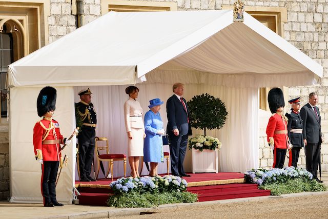 Britain's Queen Elizabeth II stands with US President Donald Trump and US First Lady Melania Trump on their arrival at Windsor Castle in Windsor, west of London, on July 13, 2018 on the second day of Trump's UK visit. - US President Donald Trump on Friday played down his extraordinary attack on Britain's plans for Brexit, praising Prime Minister Theresa May and insisting bilateral relations "have never been stronger", even as tens of thousands protested in London against his visit. (Photo by Brendan Smialowski / AFP) (Photo credit should read BRENDAN SMIALOWSKI/AFP/Getty Images)