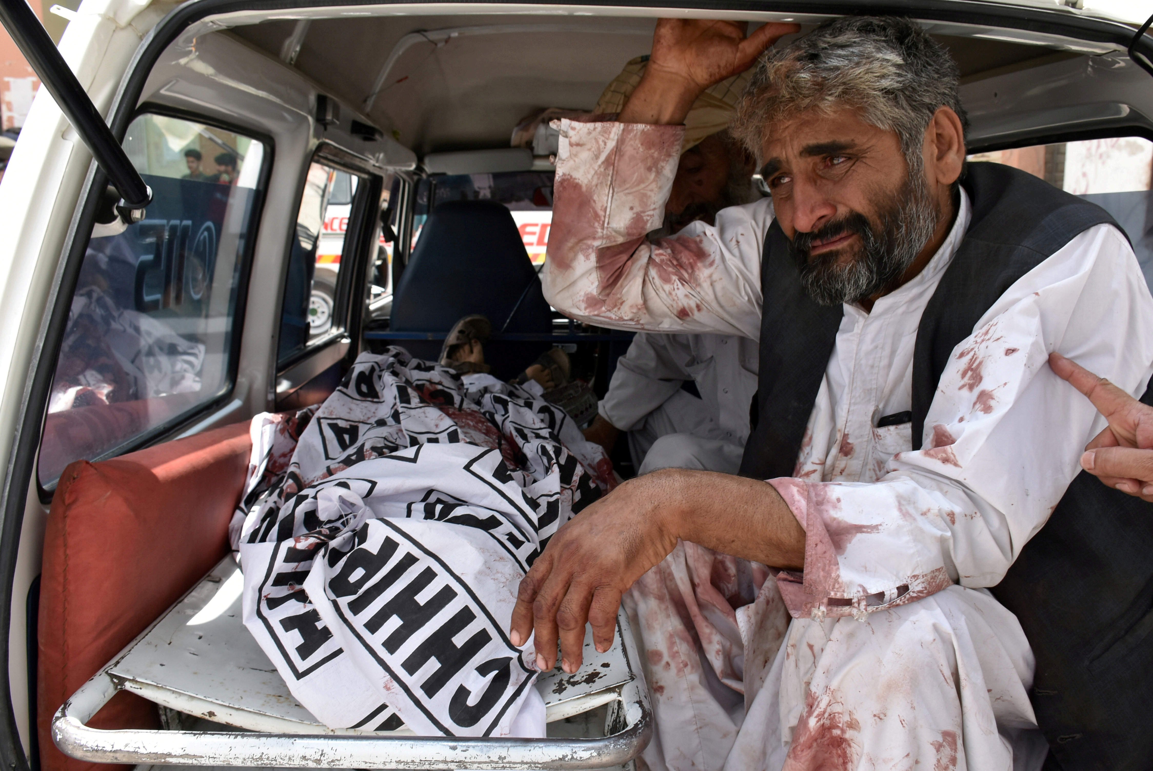 A man mourns the death of a relative, who was killed in a suicide blast in Quetta, Pakistan July 25, 2018. REUTERS/Naseer Ahmed 