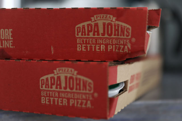 In this photo illustration, a Papa John's pizza box is seen on July 11, 2018 in Miami, Florida. The founder of Papa John's pizza, John Schnatter, apologized Wednesday for using the N-word on a conference call in May. (Photo illustration by Joe Raedle/Getty Images)