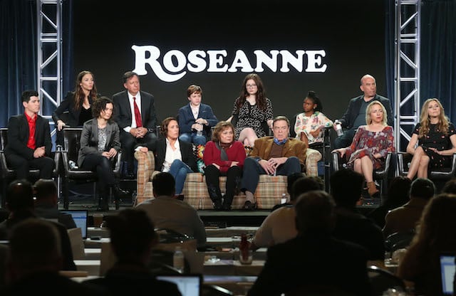 Executive producers Whitney Cummings and Tom Werner, actors Ames McNamera, Emma Kenney, Jayden Rey, executive producer Bruce Helford, (l-r, front row) actor Michael Fishman, executive producer/actress Sara Gilbert, actress Laurie Metcalf, executive producer/actress Roseanne Barr, actors John Goodman, Lecy Goranson and Sarah Chalke of the television show Roseanne speak onstage during the ABC Television/Disney portion of the 2018 Winter Television Critics Association Press Tour at The Langham Huntington, Pasadena on January 8, 2018 in Pasadena, California. (Photo by Frederick M. Brown/Getty Images)