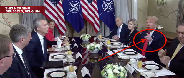 Trump points to the media during NATO conference. MSNBC screenshot