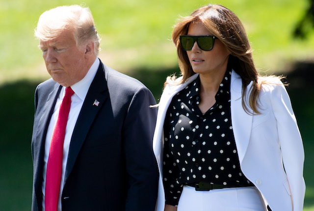 US President Donald Trump and First Lady Melania Trump walk to Marine One prior to departing from the South Lawn of the White House in Washington, DC, August 24, 2018, as they travel to Ohio. (Photo credit: SAUL LOEB/AFP/Getty Images)