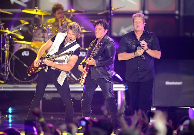 Joe Don Rooney and Jay DeMarcus of Rascal Flatts perform with Arnel Pineda of Journey onstage at the 2012 CMT Music awards at the Bridgestone Arena on June 6, 2012 in Nashville, Tennessee. (Photo by Jason Merritt/Getty Images)