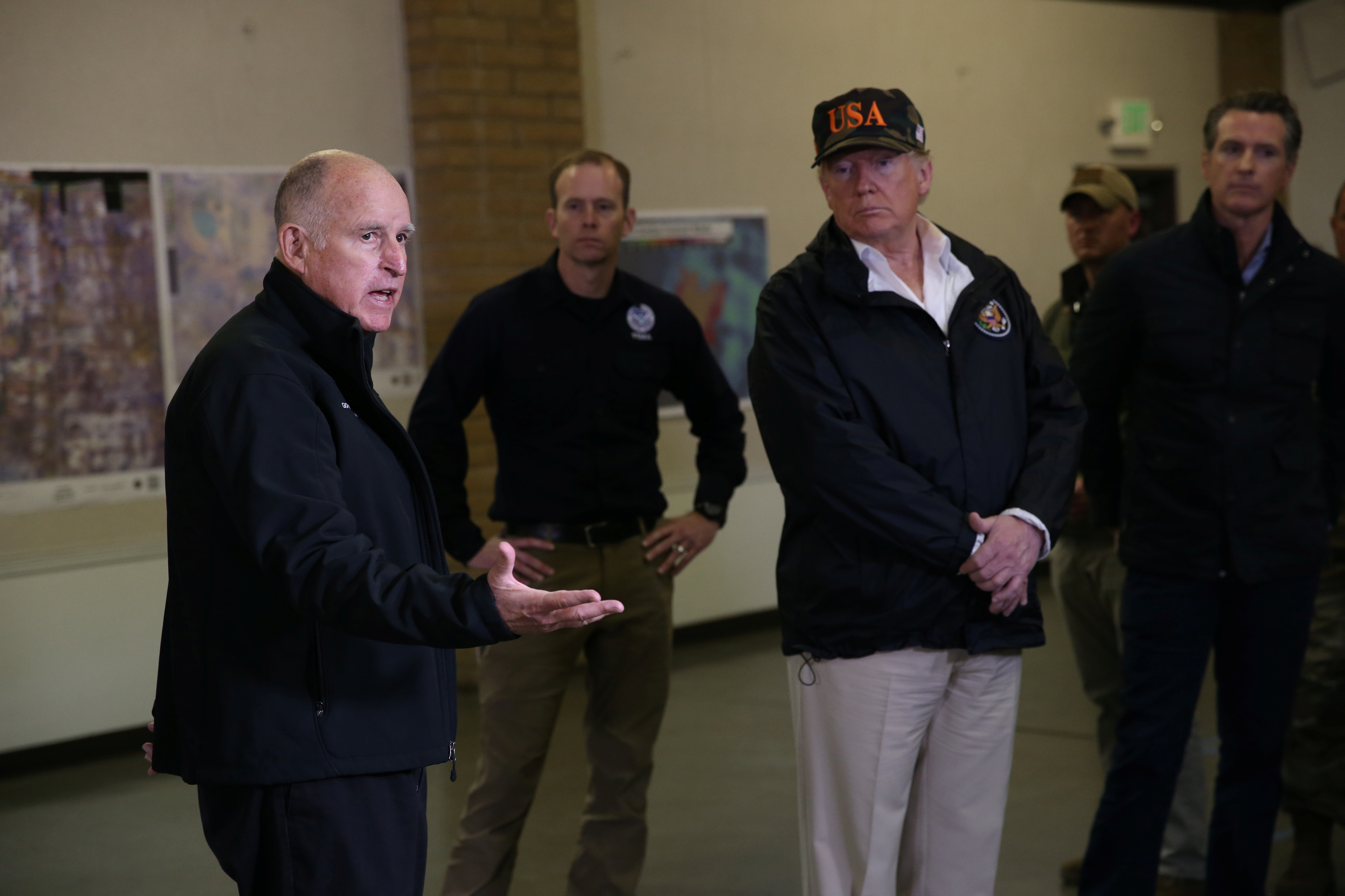 Governor Jerry Brown speaks during a briefing with State officials with President Trump at the incident command post in Chico California
